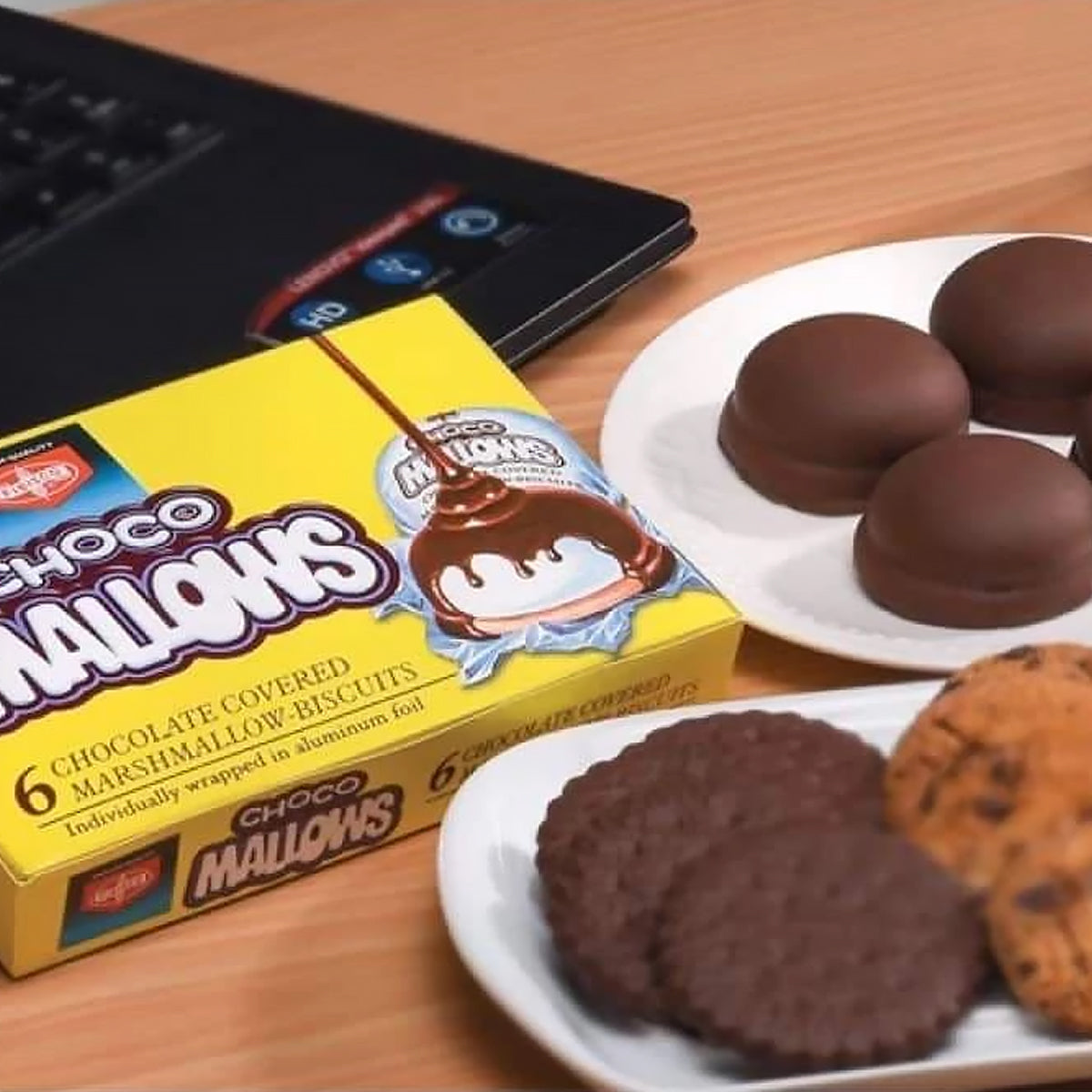 Box of Choco Mallows with cookies on a table