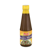Bottle of Buenas Bagoong Balayan salted fish sauce on a white background