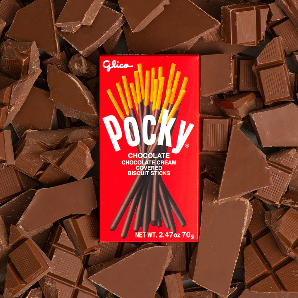 Pocky packaging surrounded by chocolate pieces