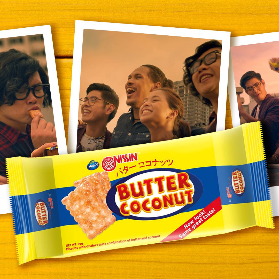 Nissin Butter Coconut biscuit package with people in the background
